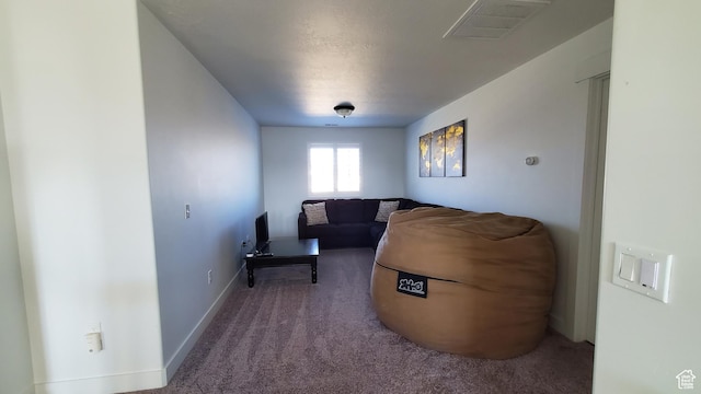 living room with carpet floors and baseboards