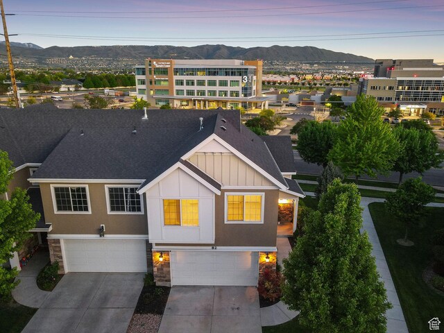 82 E Danta Dr S, Draper, UT 84020 - view of front of property with an attached garage, a mountain view, board and batten siding, concrete driveway, and stone siding