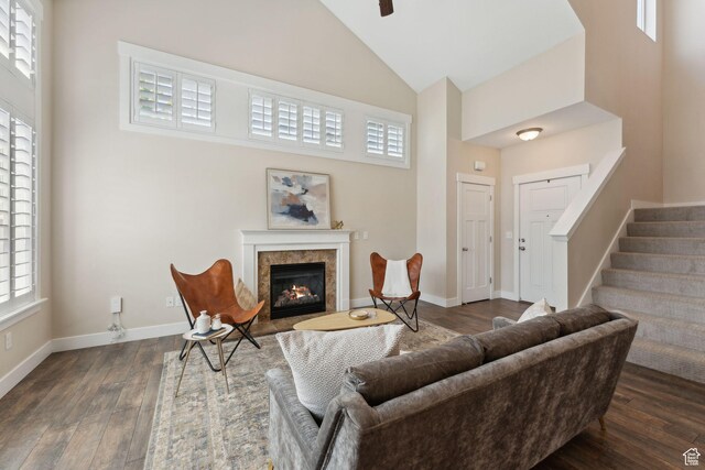 82 E Danta Dr S, Draper, UT 84020 - living room featuring high vaulted ceiling, hardwood / wood-style floors, a fireplace with flush hearth, stairway, and baseboards