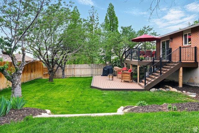 view of yard featuring a wooden deck and stairs