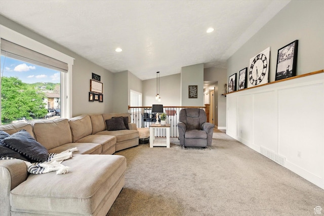 living room featuring light colored carpet and recessed lighting