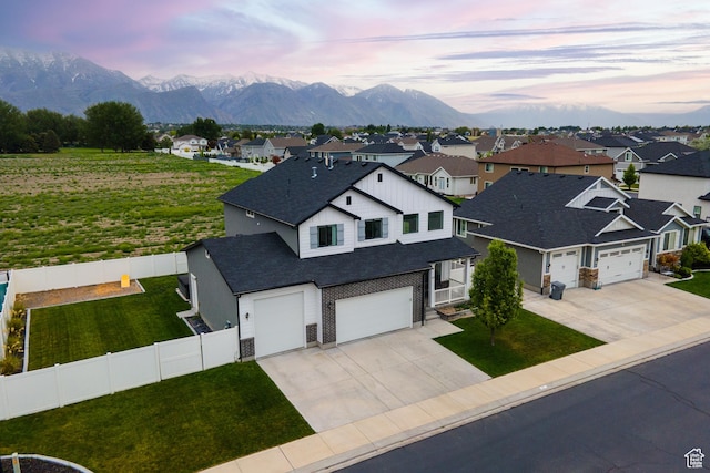 57 S Sterling Way, Vineyard, UT 84059 - view of front facade with concrete driveway, a residential view, a mountain view, and a shingled roof