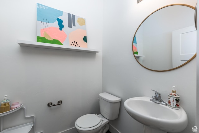 57 S Sterling Way, Vineyard, UT 84059 - half bathroom featuring a sink, toilet, and baseboards