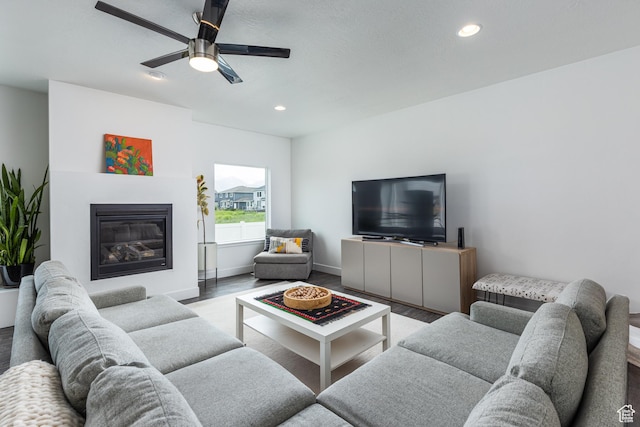 57 S Sterling Way, Vineyard, UT 84059 - living area with wood finished floors, recessed lighting, ceiling fan, a glass covered fireplace, and baseboards