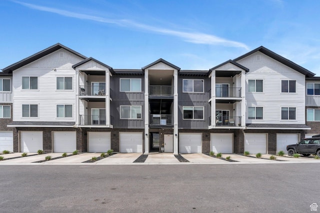 1218 S Sawmill Blvd Unit 1-106, Heber City, UT 84032 - view of property with a garage and driveway