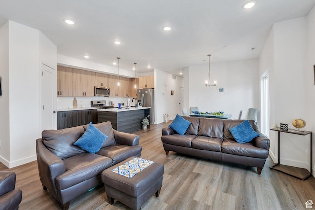 1218 S Sawmill Blvd Unit 1-106, Heber City, UT 84032 - living area featuring light wood-style floors, a chandelier, recessed lighting, and baseboards