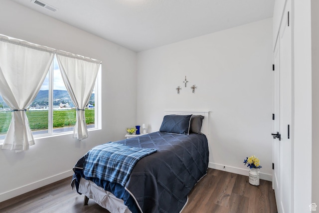 1218 S Sawmill Blvd Unit 1-106, Heber City, UT 84032 - bedroom with baseboards, wood finished floors, and a mountain view