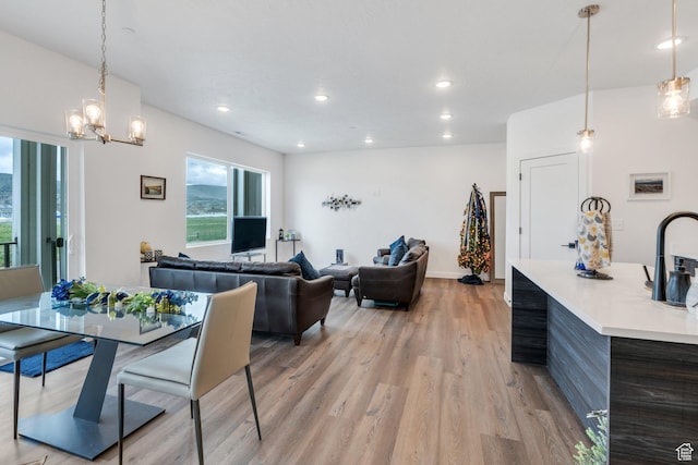 1218 S Sawmill Blvd Unit 1-106, Heber City, UT 84032 - dining space featuring light wood finished floors, a chandelier, recessed lighting, and baseboards
