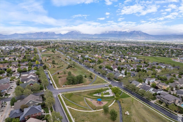 aerial overview of property's location featuring mountains and nearby suburban area