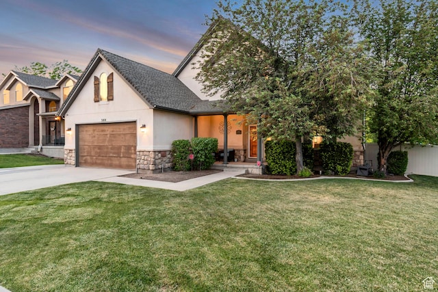 5414 W Island Creek Dr S, West Jordan, UT 84081 - view of front of home featuring stone siding, a garage, concrete driveway, a shingled roof, and a yard