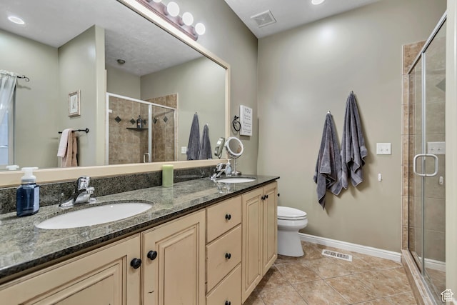 5414 W Island Creek Dr S, West Jordan, UT 84081 - full bath featuring a shower stall, double vanity, tile patterned flooring, toilet, and baseboards