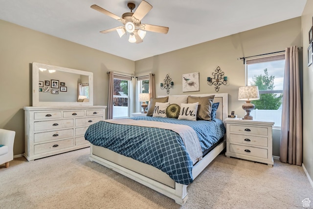 5414 W Island Creek Dr S, West Jordan, UT 84081 - bedroom with light colored carpet, multiple windows, baseboards, and ceiling fan