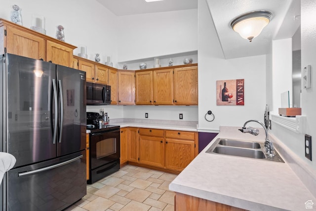 1512 N 1335 W, Orem, UT 84057 - kitchen featuring black appliances, a sink, light countertops, brown cabinetry, and a peninsula