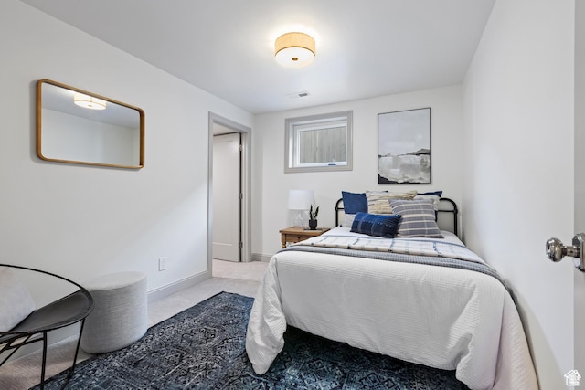 carpeted bedroom featuring baseboards