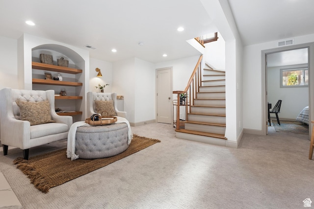 sitting room with carpet flooring, stairway, baseboards, and recessed lighting
