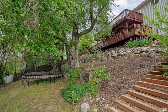 2142 Alaska Ave, Provo, UT 84606 - view of yard with stairway, a trampoline, and a deck