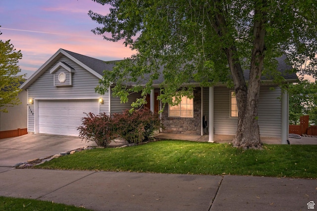 2142 Alaska Ave, Provo, UT 84606 - view of front of house with concrete driveway, an attached garage, a lawn, a shingled roof, and a porch