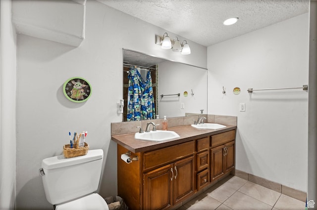 2142 Alaska Ave, Provo, UT 84606 - bathroom with a textured ceiling, tile patterned flooring, toilet, baseboards, and curtained shower