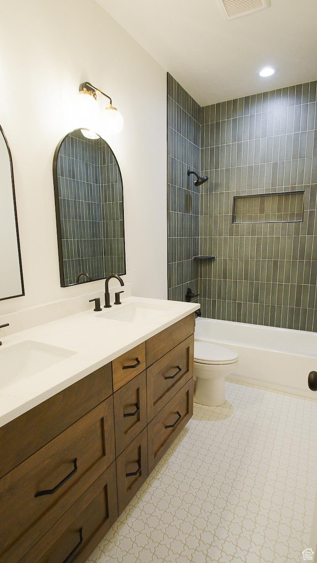 full bathroom with double vanity, toilet, shower / bathtub combination, and recessed lighting