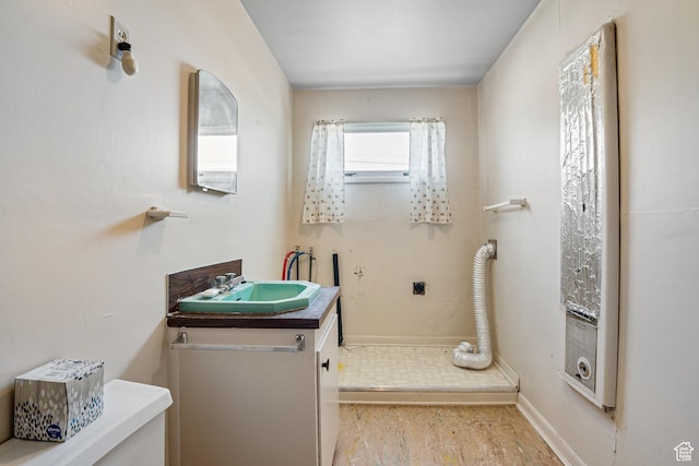 bathroom with baseboards and vanity