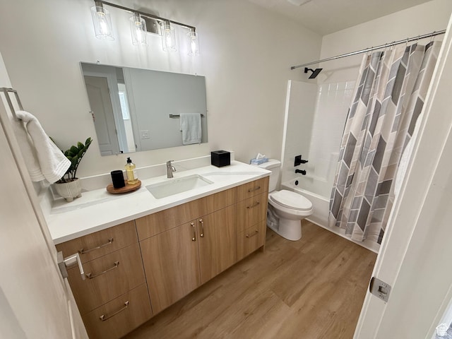 7038 W 8090 S, West Jordan, UT 84081 - bathroom featuring toilet, wood finished floors, vanity, and shower / bath combo