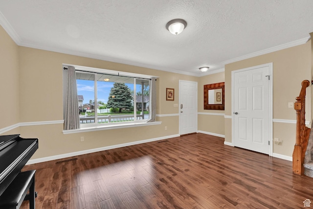 1780 N 800 E, North Ogden, UT 84414 - entrance foyer with wood finished floors, a textured ceiling, ornamental molding, and baseboards