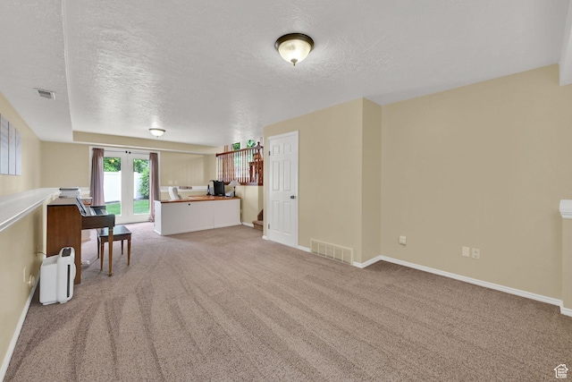 1780 N 800 E, North Ogden, UT 84414 - living room featuring a textured ceiling, light colored carpet, a desk, and baseboards