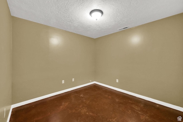 1780 N 800 E, North Ogden, UT 84414 - empty room featuring finished concrete flooring, baseboards, and a textured ceiling