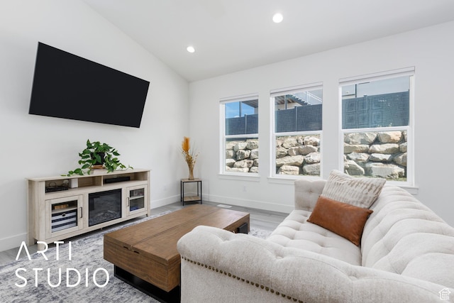 752 N Sunset Dr, Morgan, UT 84050 - living area with vaulted ceiling, recessed lighting, wood finished floors, and baseboards