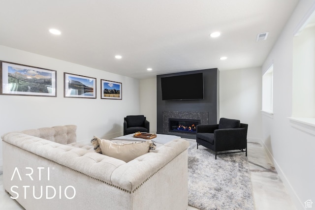 752 N Sunset Dr, Morgan, UT 84050 - living room featuring recessed lighting, a glass covered fireplace, and baseboards