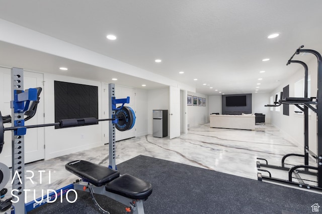 752 N Sunset Dr, Morgan, UT 84050 - exercise room with recessed lighting, marble finish flooring, and stacked washing machine and dryer