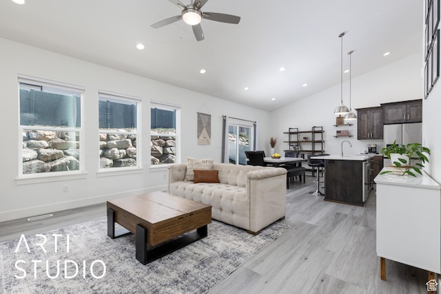 752 N Sunset Dr, Morgan, UT 84050 - living area with vaulted ceiling, ceiling fan, light wood finished floors, recessed lighting, and baseboards