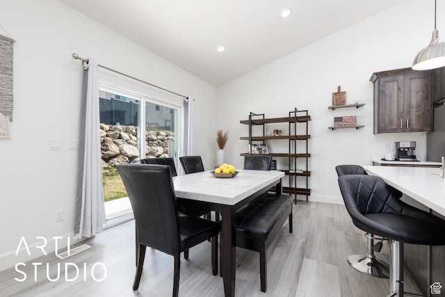 752 N Sunset Dr, Morgan, UT 84050 - dining room featuring light wood finished floors, recessed lighting, baseboards, and lofted ceiling