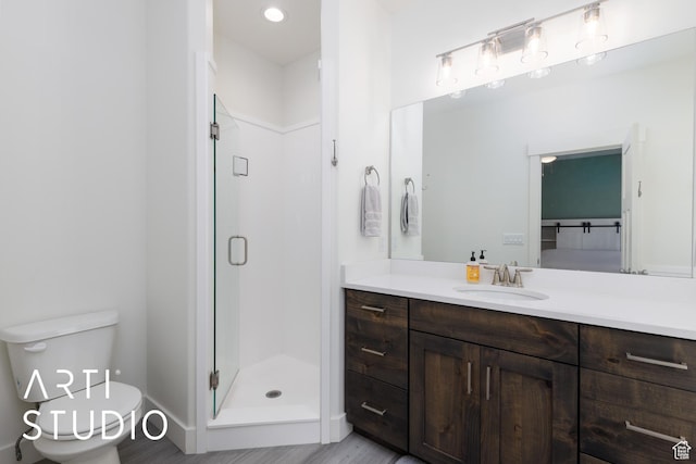 752 N Sunset Dr, Morgan, UT 84050 - bathroom with a stall shower, vanity, toilet, and wood finished floors