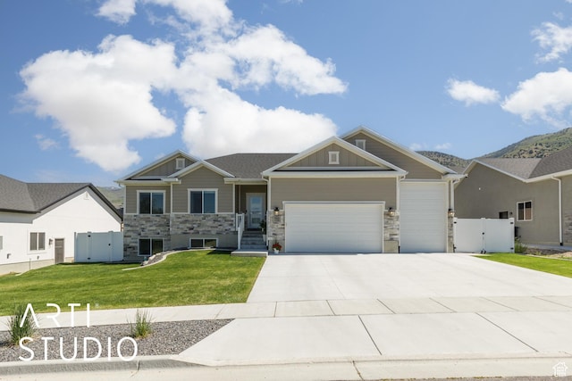 752 N Sunset Dr, Morgan, UT 84050 - craftsman-style house with a gate, stone siding, and a garage