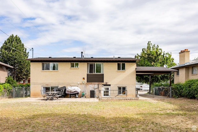2135 W 4300 S, Roy, UT 84067 - rear view of property with a gate, brick siding, a patio, and central AC unit