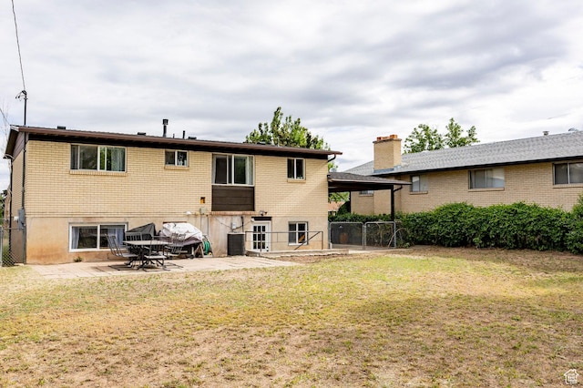2135 W 4300 S, Roy, UT 84067 - back of property with a patio and brick siding