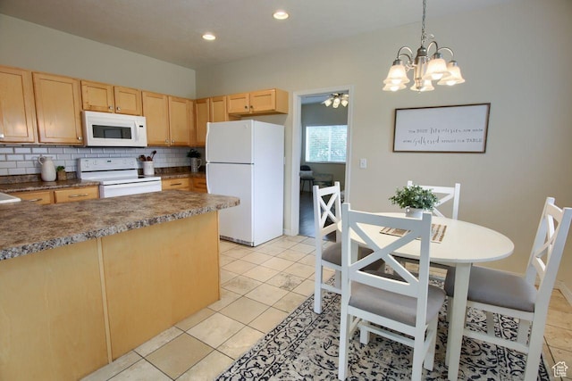 kitchen featuring white appliances, light brown cabinets, backsplash, a chandelier, and dark countertops