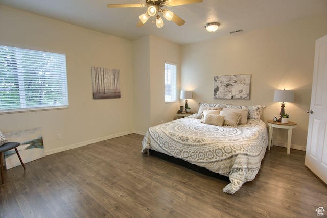 bedroom with wood finished floors, baseboards, and ceiling fan