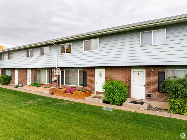 1088 N Nayon Dr Unit B, Layton, UT 84040 - townhome / multi-family property featuring brick siding and a front lawn