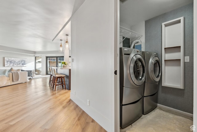 900 S Donner Way E Unit 707, Salt Lake City, UT 84108 - laundry area with separate washer and dryer and light wood-type flooring