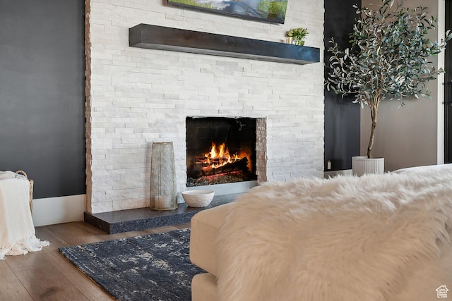 900 S Donner Way E Unit 707, Salt Lake City, UT 84108 - bedroom with a fireplace and wood finished floors
