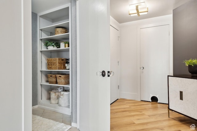 900 S Donner Way E Unit 707, Salt Lake City, UT 84108 - hallway with light wood-type flooring and baseboards