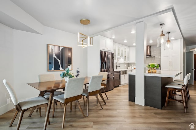 900 S Donner Way E Unit 707, Salt Lake City, UT 84108 - dining area with light wood-style floors and recessed lighting