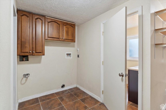 22 W 1470 S, Farmington, UT 84025 - laundry room featuring hookup for an electric dryer, washer hookup, baseboards, cabinet space, and a textured ceiling