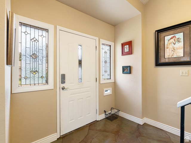 450 W Chokecherry Cir, Orem, UT 84058 - entryway with baseboards and concrete floors