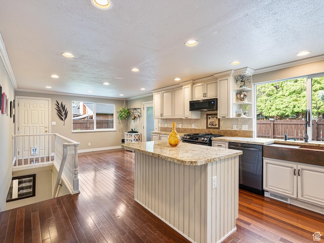 450 W Chokecherry Cir, Orem, UT 84058 - kitchen featuring dishwashing machine, black microwave, a sink, ornamental molding, and stainless steel gas range oven