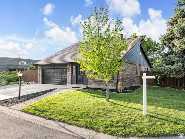 450 W Chokecherry Cir, Orem, UT 84058 - view of front facade with brick siding, a garage, driveway, and a tile roof