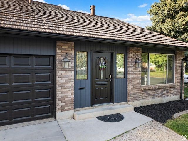 450 W Chokecherry Cir, Orem, UT 84058 - doorway to property with brick siding and concrete driveway