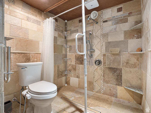 450 W Chokecherry Cir, Orem, UT 84058 - full bath featuring tiled shower, toilet, stone tile flooring, and tile walls